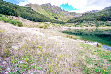Fototapeta na wymiar Mountain lake in the Italian Alps