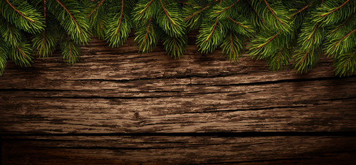 Naklejka premium Christmas wooden background with fir branches