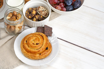 Obraz na płótnie Canvas Breakfast with biscuits, chocolate, fruit and coffee milk