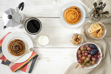 Breakfast with biscuits, chocolate, fruit and coffee milk