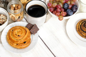 Breakfast with biscuits, chocolate, fruit and coffee milk