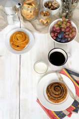 Breakfast with biscuits, chocolate, fruit and coffee milk