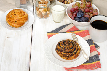 Breakfast with biscuits, chocolate, fruit and coffee milk