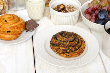 Breakfast with biscuits, chocolate, fruit and coffee milk