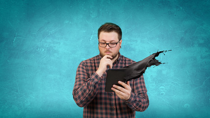 Man using digital tablet . Mixed media