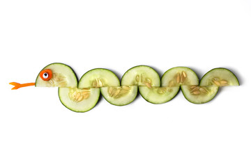 Food art creative concepts. Funny and cute animal made of cucumber and carrots isolated on a white background.