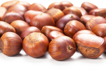 Group of grilled chestnuts. Isolate on white background. Autumn background.