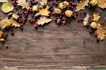 Autumn background: wood with oak leaves and acorns