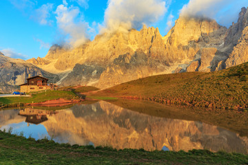 Sunset near Passo Rolle in the Dolomites Alps 