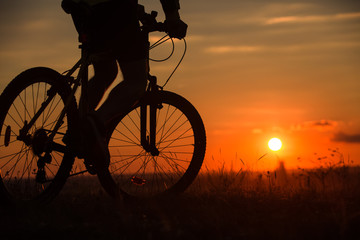 Fototapeta na wymiar Silhouette of a bike on sky background