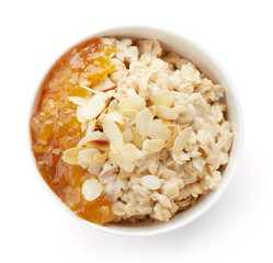 Bowl of healthy oatmeal isolated on white