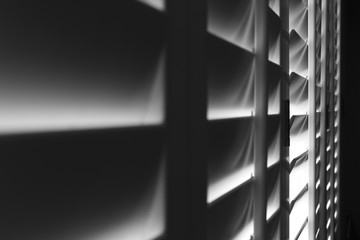 Living room blinds allowing in a bit of light