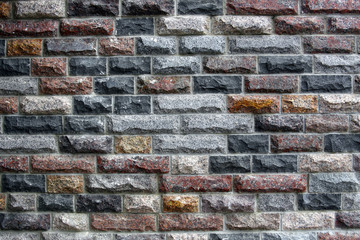 Texture of ancient wall of colored bricks
