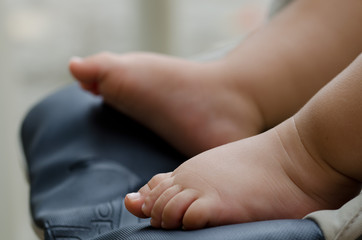 of baby feet, baby first steps. pink leather