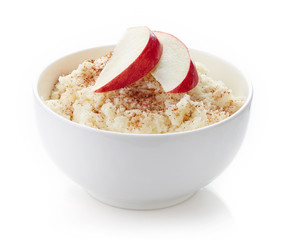 Bowl of rice flakes porridge isolated on white