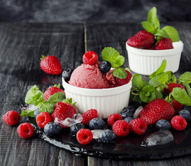 fruit ice cream with fresh strawberries, blueberries and raspberries