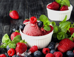 fruit ice cream with fresh strawberries, blueberries and raspberries