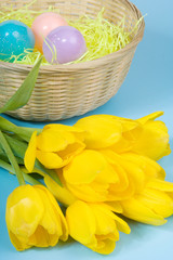 Easter Tulips – Yellow tulips and an Easter basket with eggs.