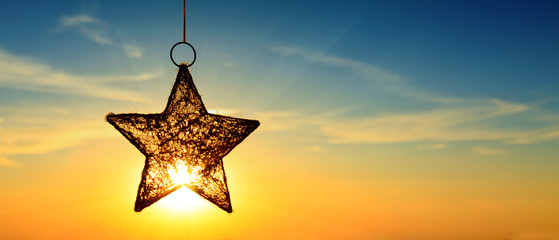 Christmas star and bright sun.