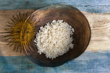 Poverty concept, bowl of rice with Argentine flag