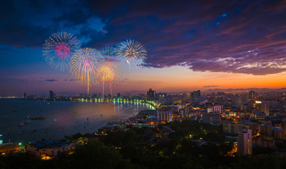 Naklejka na ściany i meble Multicolor fireworks night scene, blurred photo pattaya cityscap