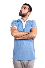 Man with blue shirt having doubts