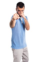 Fototapeta premium Man with blue shirt giving a punch
