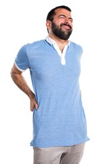 Man with blue shirt with back pain