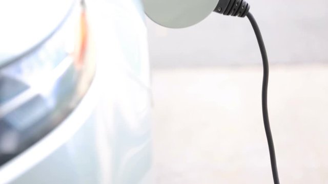 Charging electric car in residential garage