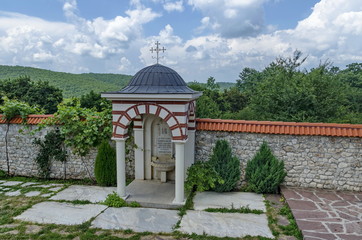 View of inner  part yard with  spring water fountain in restored Montenegrin or Giginski monastery  St. St. Cosmas and Damian, mountain  Kitka, Breznik, Pernik region, Bulgaria
