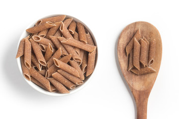 Wholemeal Pasta. Integral Penne into a bowl