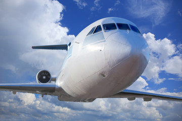 passenger plane in the blue sky