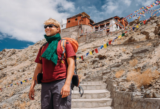 Young man tourist near the Tsemo Gompa Monastery in Leh