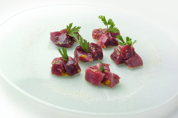 Chunks of rawbluefin tuna in ravigote sauce and parsley