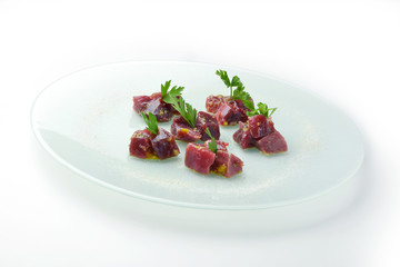 Chunks of rawbluefin tuna in ravigote sauce and parsley