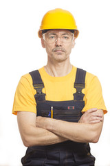 Worker in a helmet and a yellow T-shirt