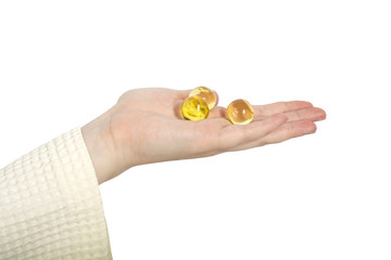 female hand holding oil balls
