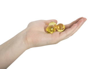 female hand holding oil balls