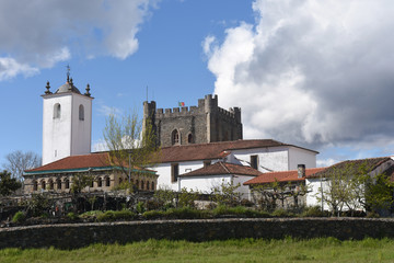 The Ancient Domus Municipalis of Braganca and Church of Santa Maria do Castelo and tower castle in the background. Braganca, Braganca District, Norte Region, Portugal, Europe