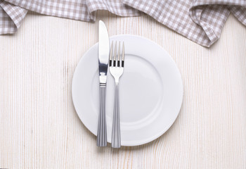  plate on white wooden table