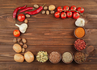 Vegetables and spices on wooden table