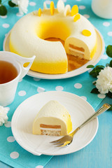 Pineapple mousse cake covered with a mirror coating.