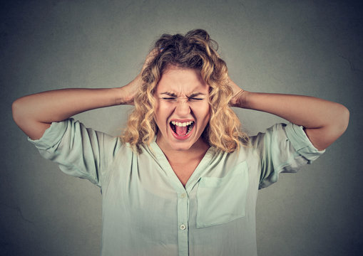 Stressed angry woman yelling screaming has temper tantrum