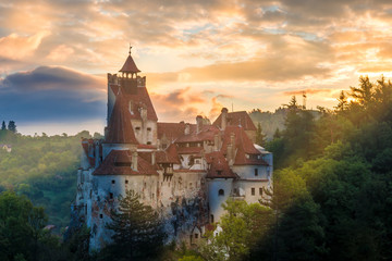 Beautiful panoramic view over Dracula Bran medieval castle in the sunset light, the most visited...