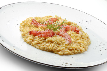 Raw red prawns on risotto Carnaroli