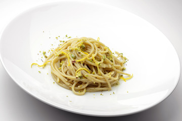 Spaghetti with salted anchovies and lemon pistachios