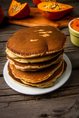 Homemade pancakes with pumpkin jam. Rustic style, on a wooden table