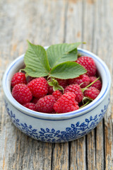 raspberry on wooden surface
