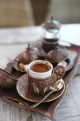 Zelfklevend Fotobehang Turkish coffee in a cafe © Olga Tkacheva