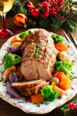 Roast pork with vegetables and spices.